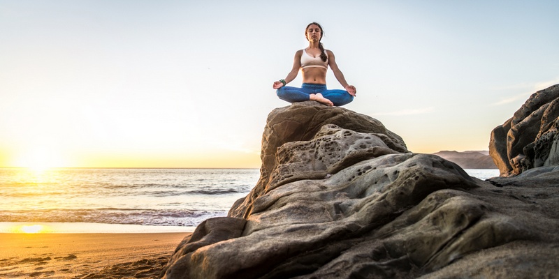 9 Tips for Women Travelling to India Practice yoga in Rishikesh